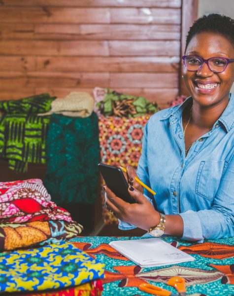 Female Fashion Designer with mobile phone